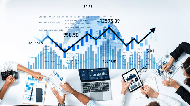 A group of business professionals collaborate on financial analysis, examining charts and graphs that depict upward trends and key data metrics in a modern office setup. Scalp - Powered by Adobe