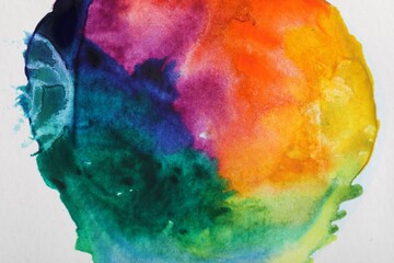 Bright watercolor painting on white paper, top view