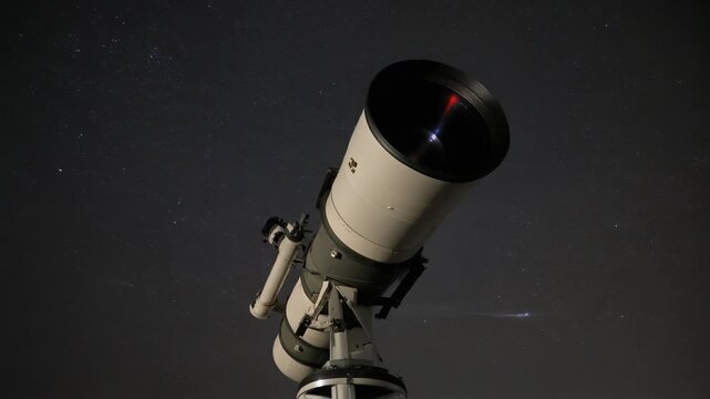 A close-up shot of a telescope on a tripod, ready for stargazing.