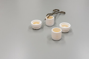 Forceps and grinding jars of mixer mills are used for the pulverization. Laboratory equipment.