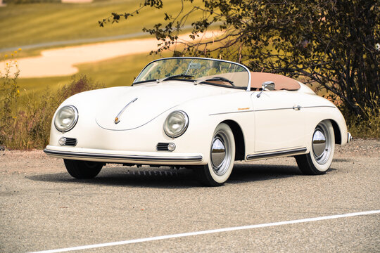 1957 Porsche 356 Speedster replica cream classic car convertible sunny day parked