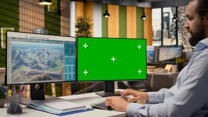 Engineer working on futuristic wind turbine concept on green screen PC designed for clean energy output. Man in office uses mockup computer to research cutting edge VAWT innovation, camera A