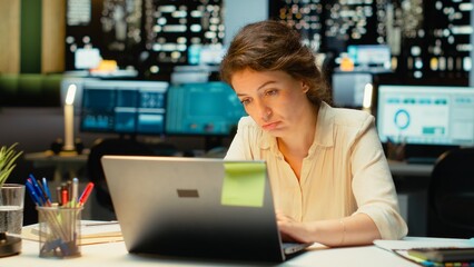 Tensed weary employee struggling with mental exhaustion and discomfort after hours, showing signs of intense workload and stress. Overwhelmed anxious woman with fatigue. Camera B.