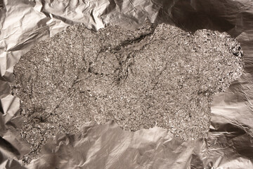 Shiny silver foil background. Top view.