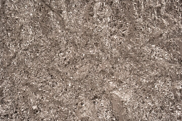 Shiny silver foil background. Top view.
