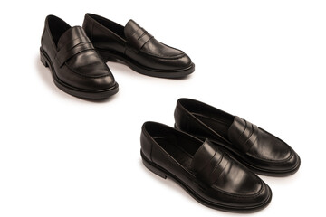 Black leather loafers isolated on white background.