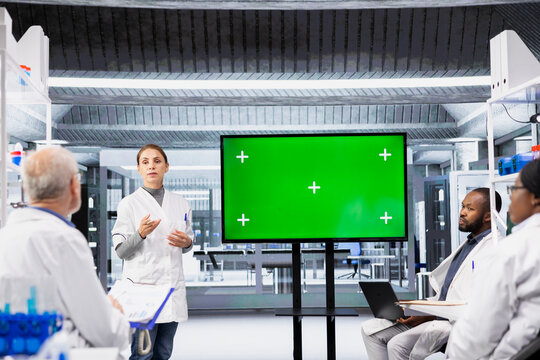 Isolated screen monitor used by lab professional giving lecture on molecular biology to students. Woman pointing at anatomical cell model on mockup screen during class in university laboratory - Powered by Adobe