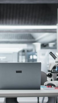 Vertical video Sterile empty medical laboratory workspace featuring test tube racks on workbench. Clean research facility interior free of contamination with nobody in, ready for scientific work
