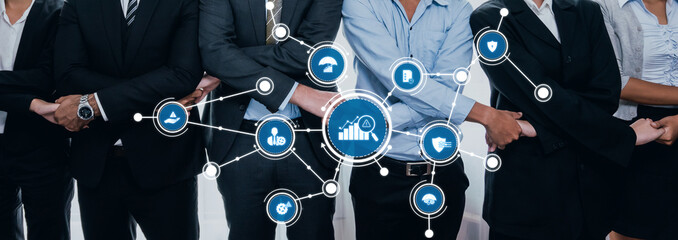 A diverse group of business professionals collaborates in a modern office setting, surrounded by technology icons representing management and data analysis concepts for growth. Amity