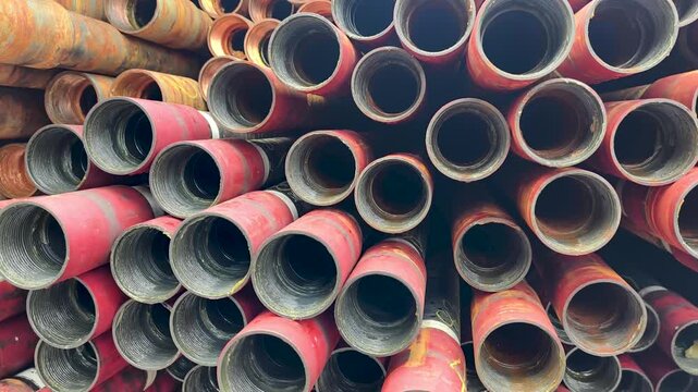 Stack of oilfield tubing taking at pin end connection for oil and gas well completion (exploration and production industry)
