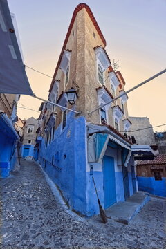 Three-story, corner house at Rue Hassan I and Habou Alley in the medina, painted blue as usual with soil color upper floors. Chefchaouen-Morocco-043