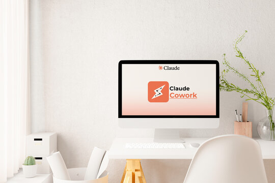 Minimalist workspace featuring computer showing claude cowork application