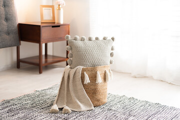A cozy bedroom featuring a bed adorned with a selection of light-colored pillow