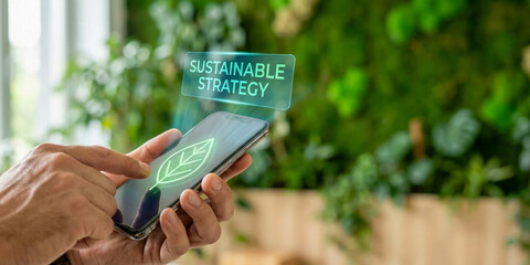 Business high level planning concept for sustainable strategy on mobile device with green leaf icon and nature background inspiring future vision
