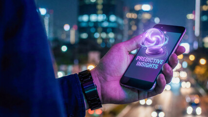 Business high level planning concept visual predictive insight on mobile phone in city night light