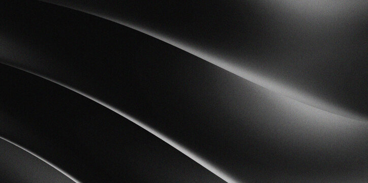 black abstract background with light accents or diagonal textures that resemble folds of fabric or fine metal.
