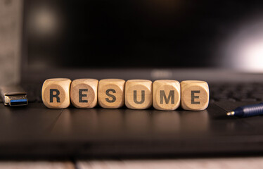 Letters RESUME written on wooden cubes,