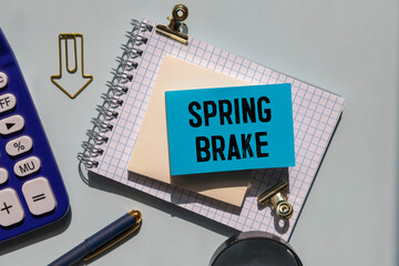 Spring Brake text on notepad, concept background.