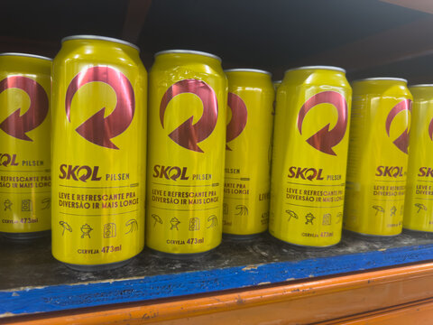 BELO HORIZONTE, MG/BRAZIL, JANUARY, 06, 2026: A close-up view of several yellow cans of Skol beer on a shelf