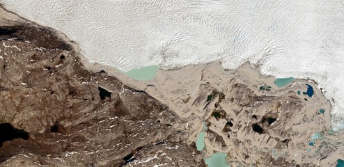 Satellite view of Greenland Arctic landscape with melting glaciers and rocky tundra