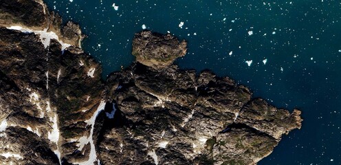 Satellite view of Greenland Arctic landscape with melting glaciers and rocky tundra