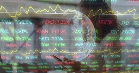 Holding woman in dark blazer tapping tablet in office, with stock tickers and globe overlay
