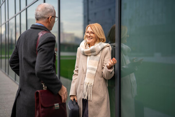 Senior business partners having outdoor consulting discussion