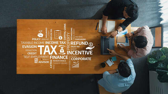 Collaborative professionals engage in discussions centered on tax strategies, focusing on income tax, refunds, and corporate incentives in a modern office environment. Amity