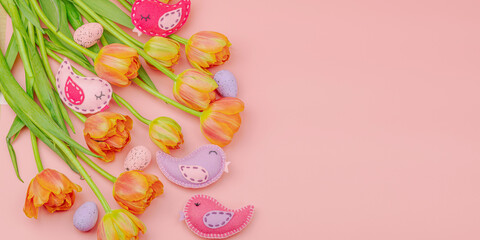 Gentle Easter composition with tulips flowers and handmade felt birds. Traditional elements
