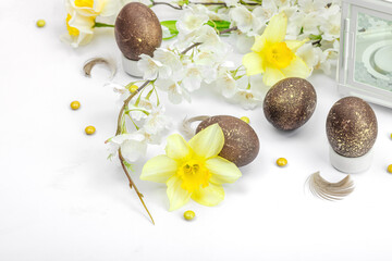 Festive Easter composition with traditional decoration. Spring flowers, Eggs, flower lantern