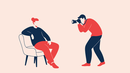 Photographer capturing a man sitting on a chair in a studio setting.