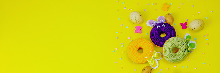 Handmade Easter concept. Crocheted donuts bunnies with tradition
