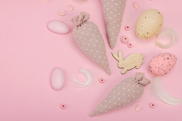 Handmade Easter concept. Sewn textile carrots with traditional decoration. Festive symbols