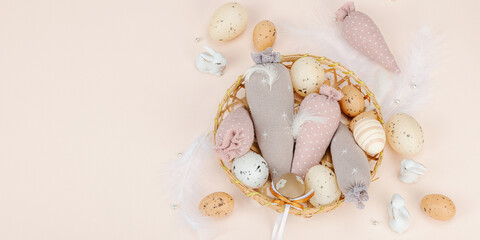 Handmade Easter concept. Sewn textile carrots with traditional decoration. Festive symbols