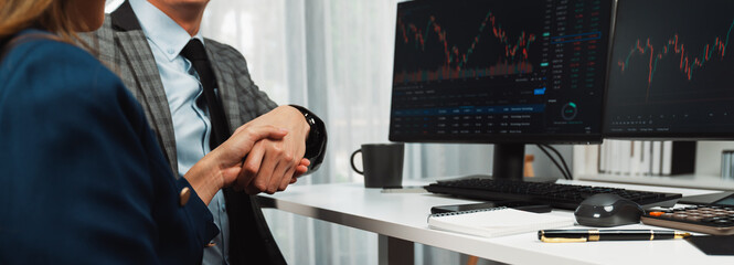 Cropped of panoramic photo making hand checking with investors to good deal in financial on online website program application with dynamic stock market at home office at back side view. Infobahn.