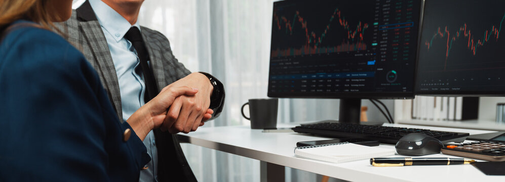 Cropped of panoramic photo making hand checking with investors to good deal in financial on online website program application with dynamic stock market at home office at back side view. Infobahn. - Powered by Adobe