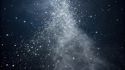 Fototapeta premium A mesmerizing view of sparkling cosmic particles against a dark backdrop, evoking a sense of wonder and the vastness of the universe.