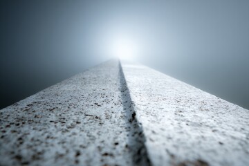 A concrete monorail track leads into a bright and hazy sky