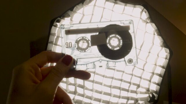 Retro audio cassette tape close-up showing classic analog format on lightbox