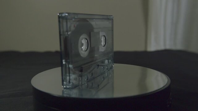 Macro view of a vintage music cassette tape in plastic storage case
