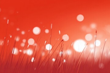 Abstract red background with grass and bokeh light effects. Soft focus nature scene with blurred circular light spots creating dreamy atmosphere. Warm red tones with artistic bokeh photography style.
