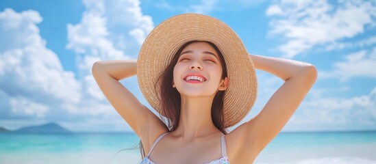 Smiling Young Woman Wearing Straw Hat Relaxing at Ocean Beach