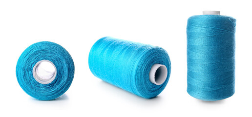 Set of blue thread spools on white background