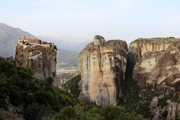 Fototapeta premium Aerial view of Meteora monasteries on top of the sandstone rock formations, elevated above the valley 
