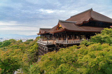 Naklejka premium Kiyomizu-dera Hondo (Main Hall) of the Kiyomizu-dera Buddhist Temple on the mount Otowa on an autumn day, Kyoto, Japan