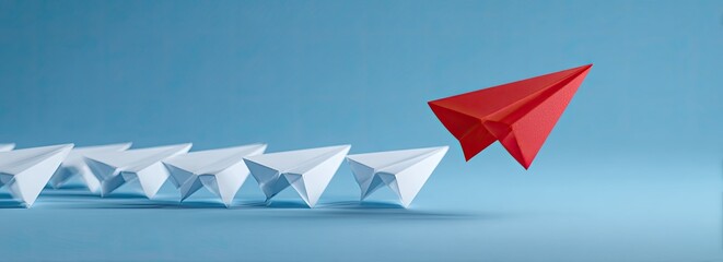 One red paper airplane leads a row of white planes on a blue background