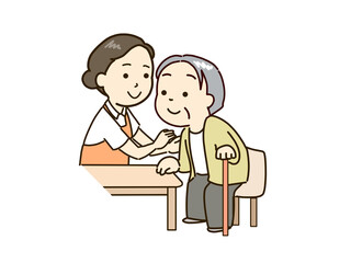 立ち上がる高齢者と支える介護士