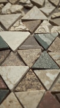 Abstract Triangular Mosaic Pattern with Earth Tone Colors and Textured Surfaces Footage