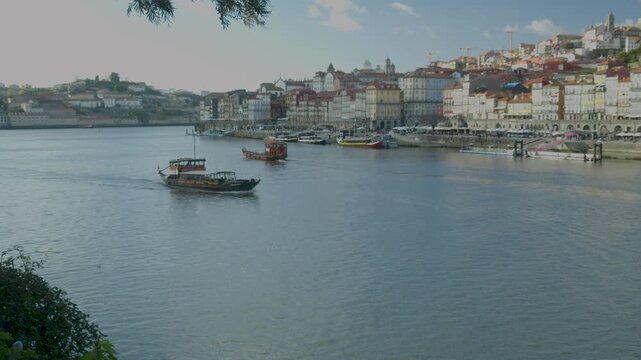Panoramic view of Porto city seen across the Douro River under soft daylight.