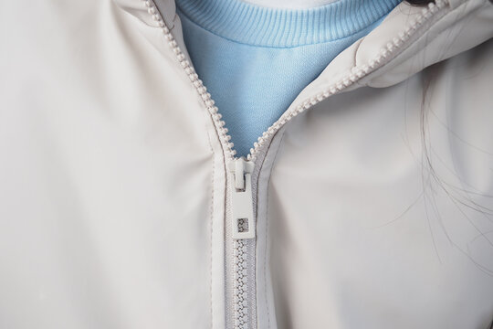 Zipper detail on jacket with blue inner layer